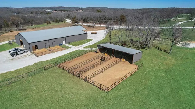 a aerial view of a house with pool table and chairs