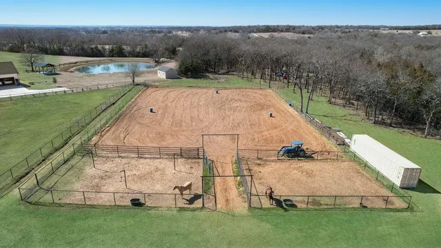 a view of a swimming pool with a yard
