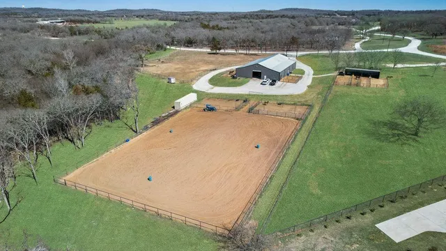 an aerial view of a house with outdoor space