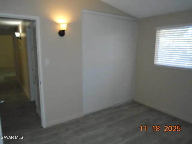a bathroom with a sink vanity mirror and toilet