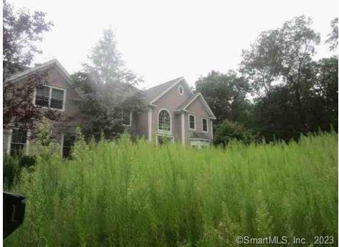 172 Beardsley Road Shelton, CT 06484 - Photo 1 of 1 a front view of a house with a yard