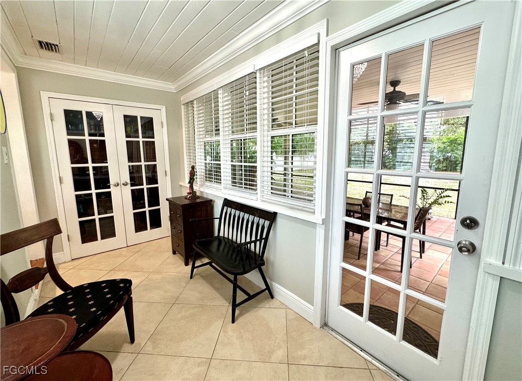 1640 Marlyn Road Fort Myers, FL 33901 - Photo 20 of 48 a view of a bedroom with furniture and a window