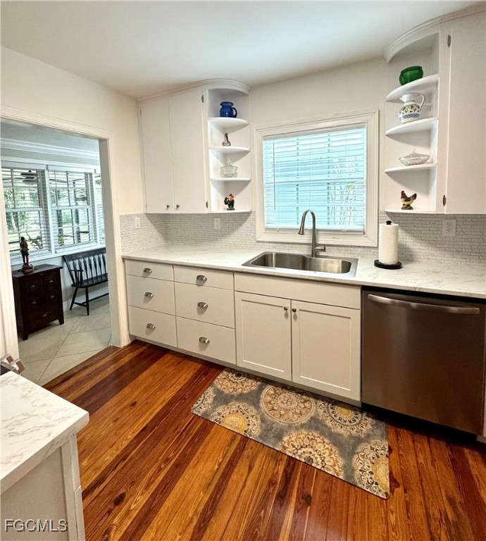 1640 Marlyn Road Fort Myers, FL 33901 - Photo 22 of 48 a kitchen with sink cabinets and wooden floor