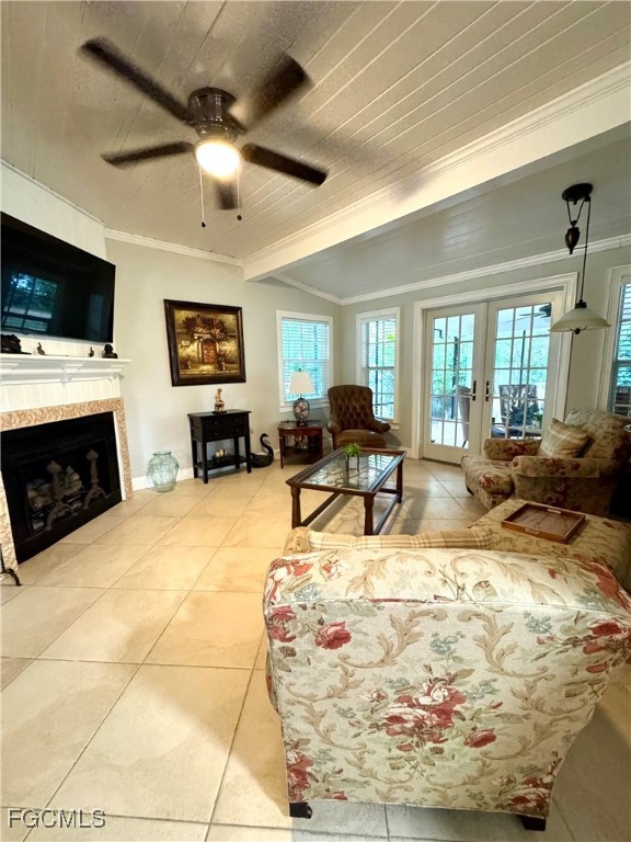 1640 Marlyn Road Fort Myers, FL 33901 - Photo 26 of 48 a living room with furniture a flat screen tv and a fireplace