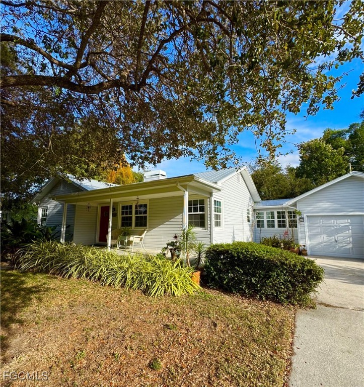 1640 Marlyn Road Fort Myers, FL 33901 - Photo 3 of 48 a front view of house with yard and trees around