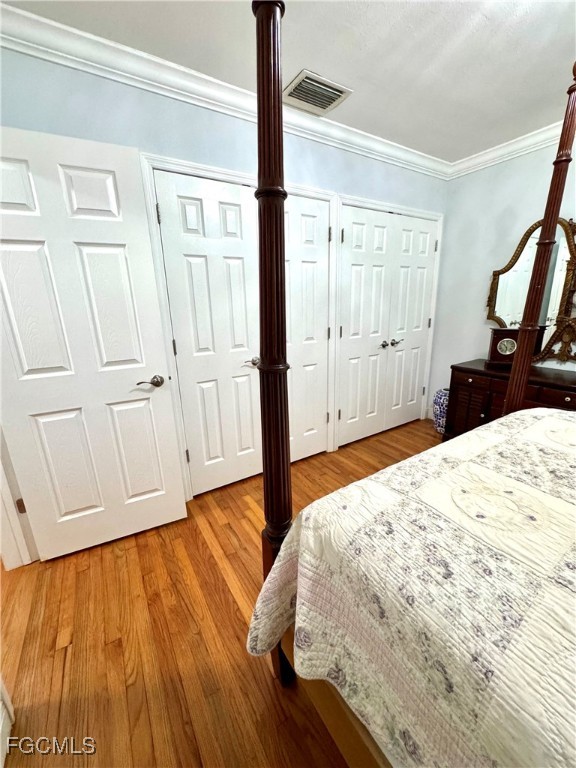 1640 Marlyn Road Fort Myers, FL 33901 - Photo 35 of 48 a bedroom with a bed and wooden floor