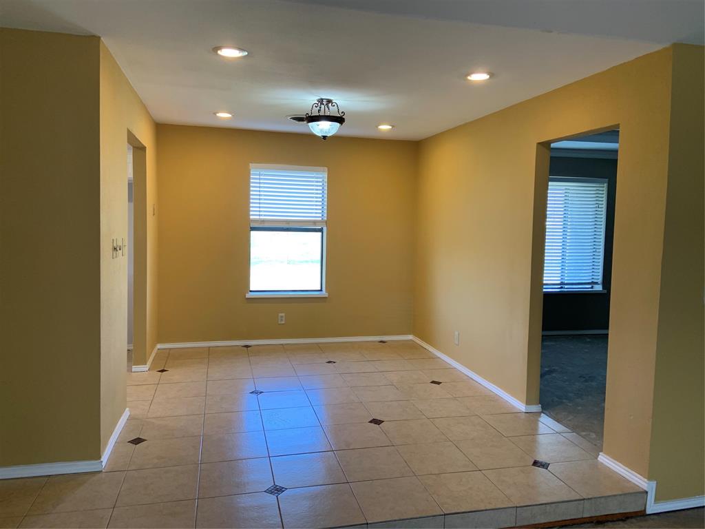 781 January Lane Ponder, TX 76259 - Photo 12 of 25 a view of hallway with a large window