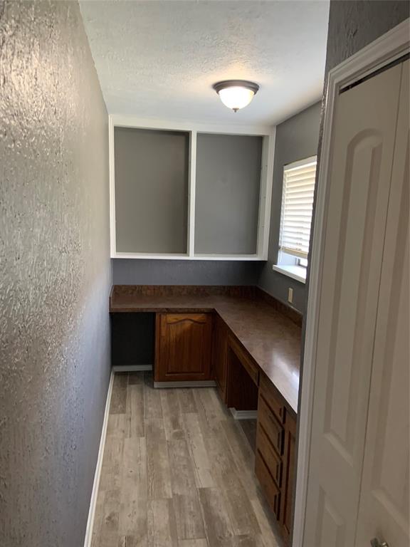 781 January Lane Ponder, TX 76259 - Photo 14 of 25 a kitchen with granite countertop a stove and a sink