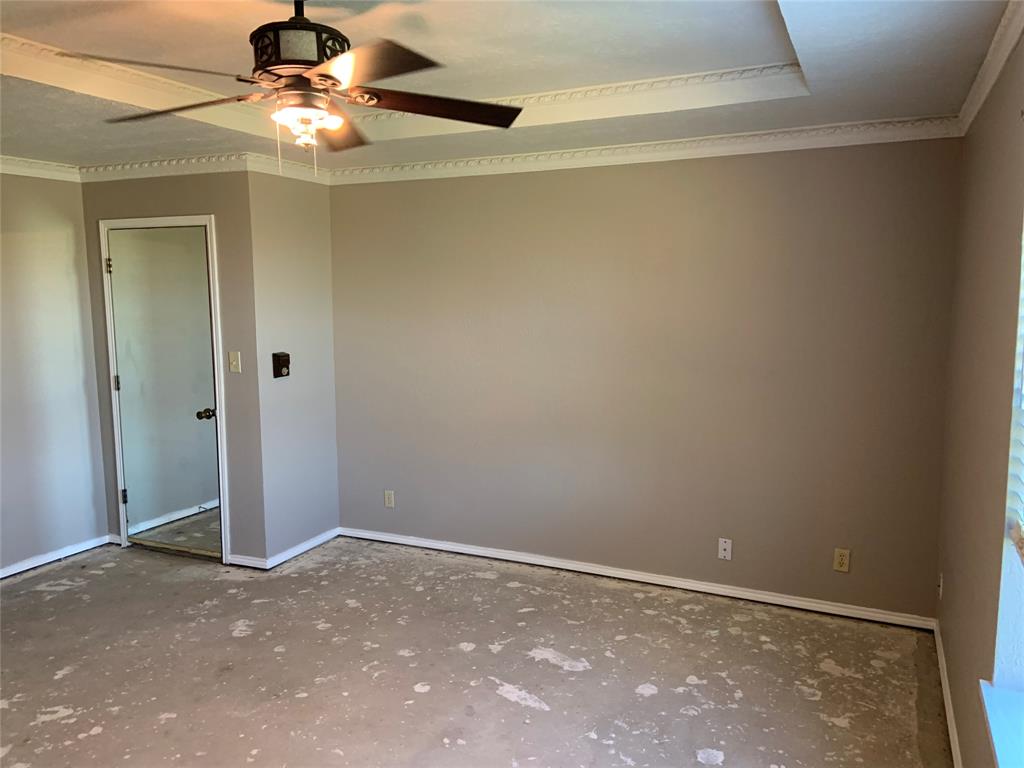 781 January Lane Ponder, TX 76259 - Photo 16 of 25 a view of an empty room with a chandelier fan