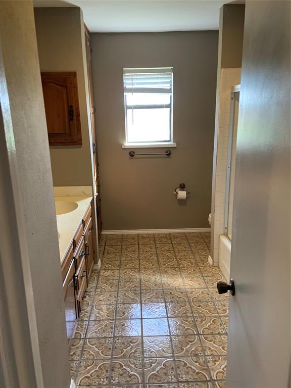 781 January Lane Ponder, TX 76259 - Photo 21 of 25 a bathroom with a sink and a shower