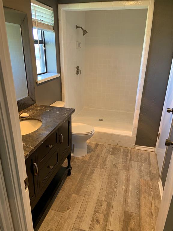781 January Lane Ponder, TX 76259 - Photo 24 of 25 a bathroom with a granite countertop sink toilet and shower
