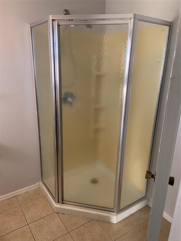781 January Lane Ponder, TX 76259 - Photo 25 of 25 a bathroom with a glass shower door