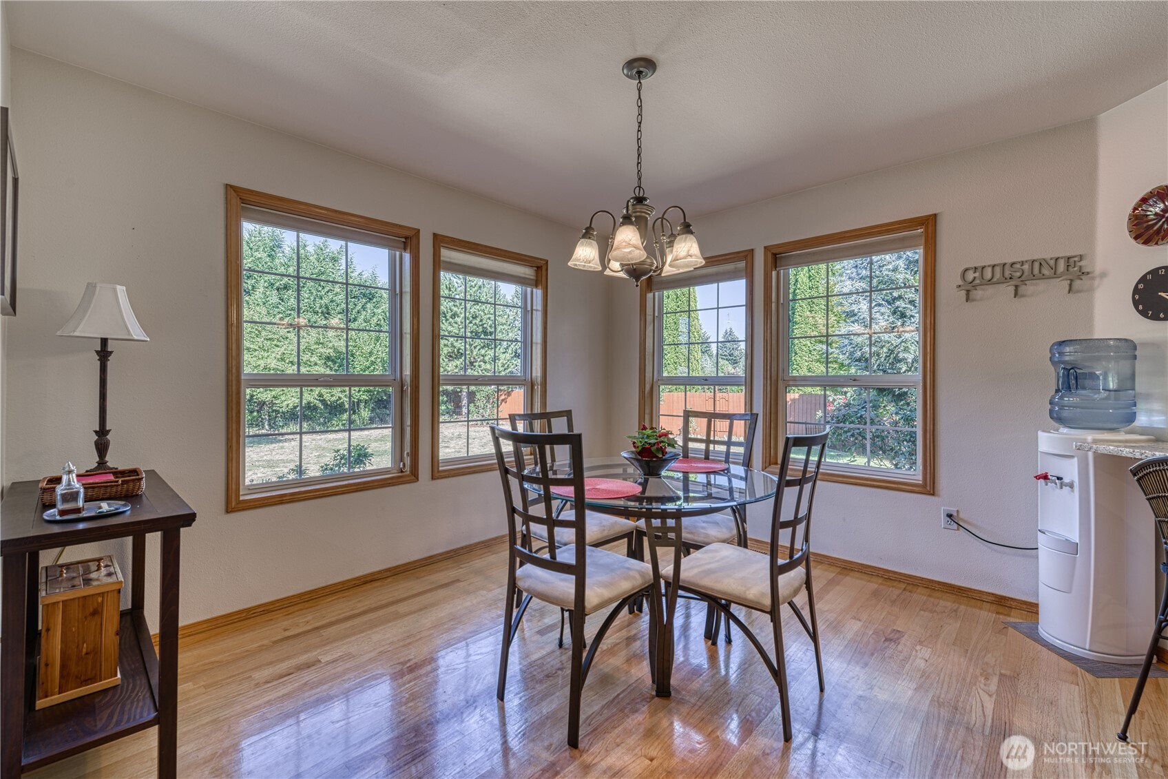 9705 346th Street South Roy, WA 98580 - Photo 15 of 34 a view of a dining room with furniture window and wooden floor