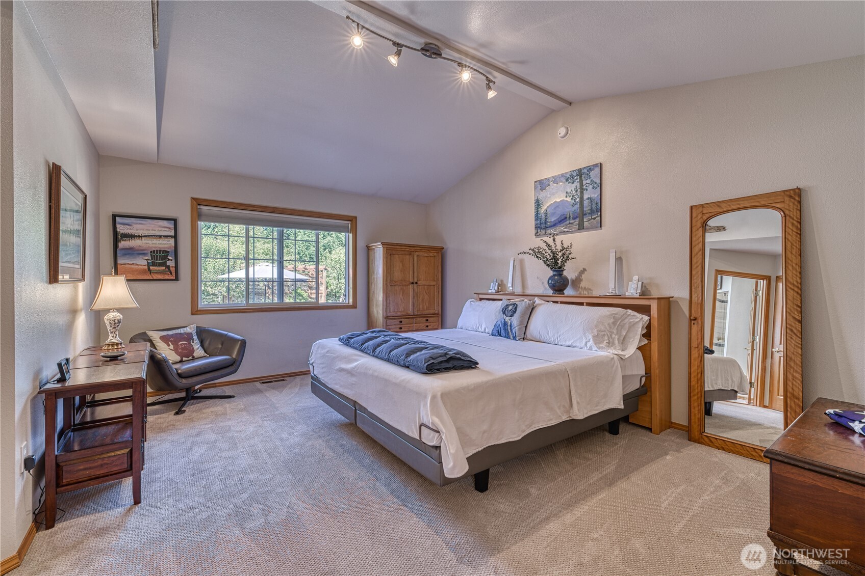 9705 346th Street South Roy, WA 98580 - Photo 16 of 34 a bedroom with a bed a couch and dresser