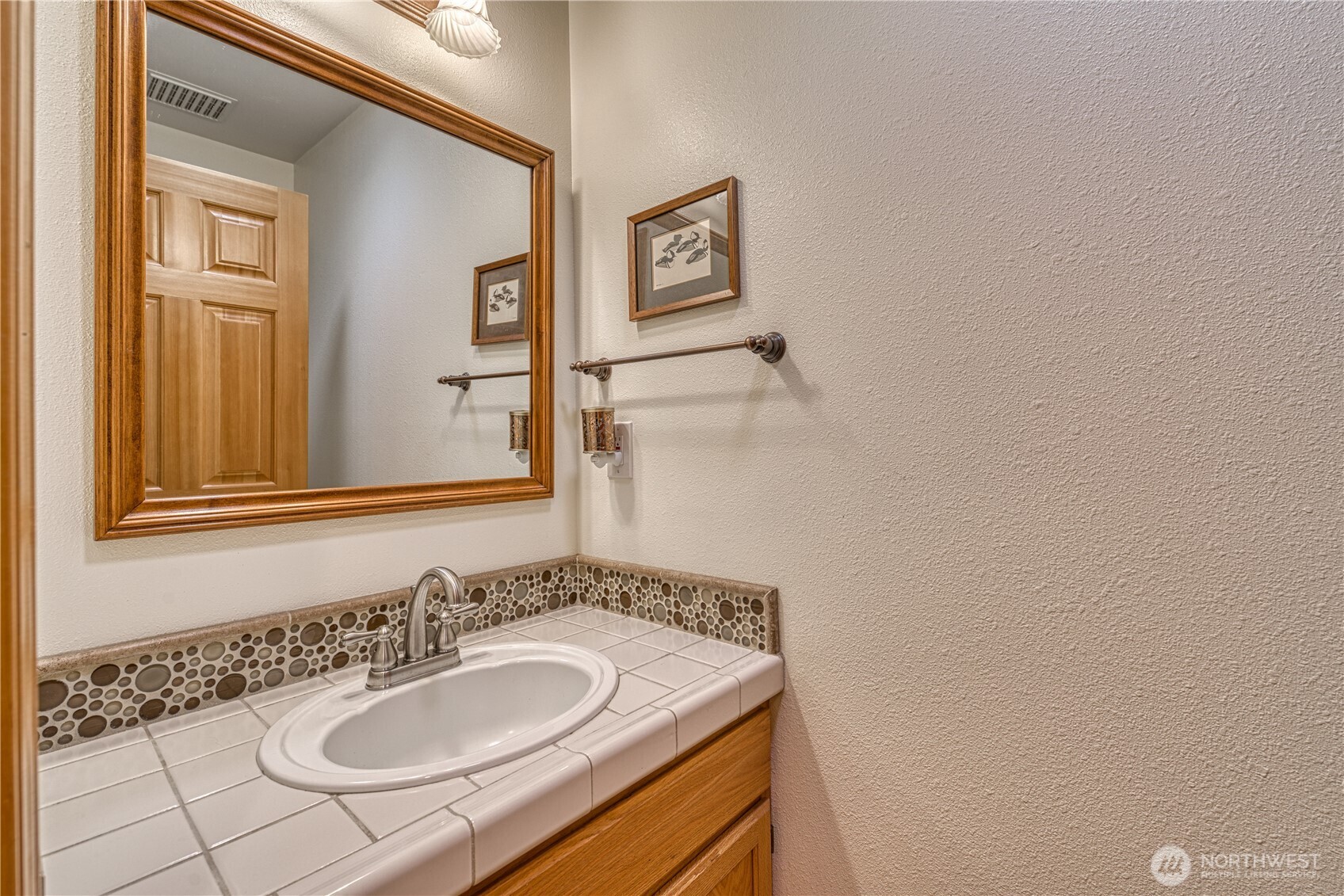 9705 346th Street South Roy, WA 98580 - Photo 23 of 34 a bathroom with a sink and a mirror