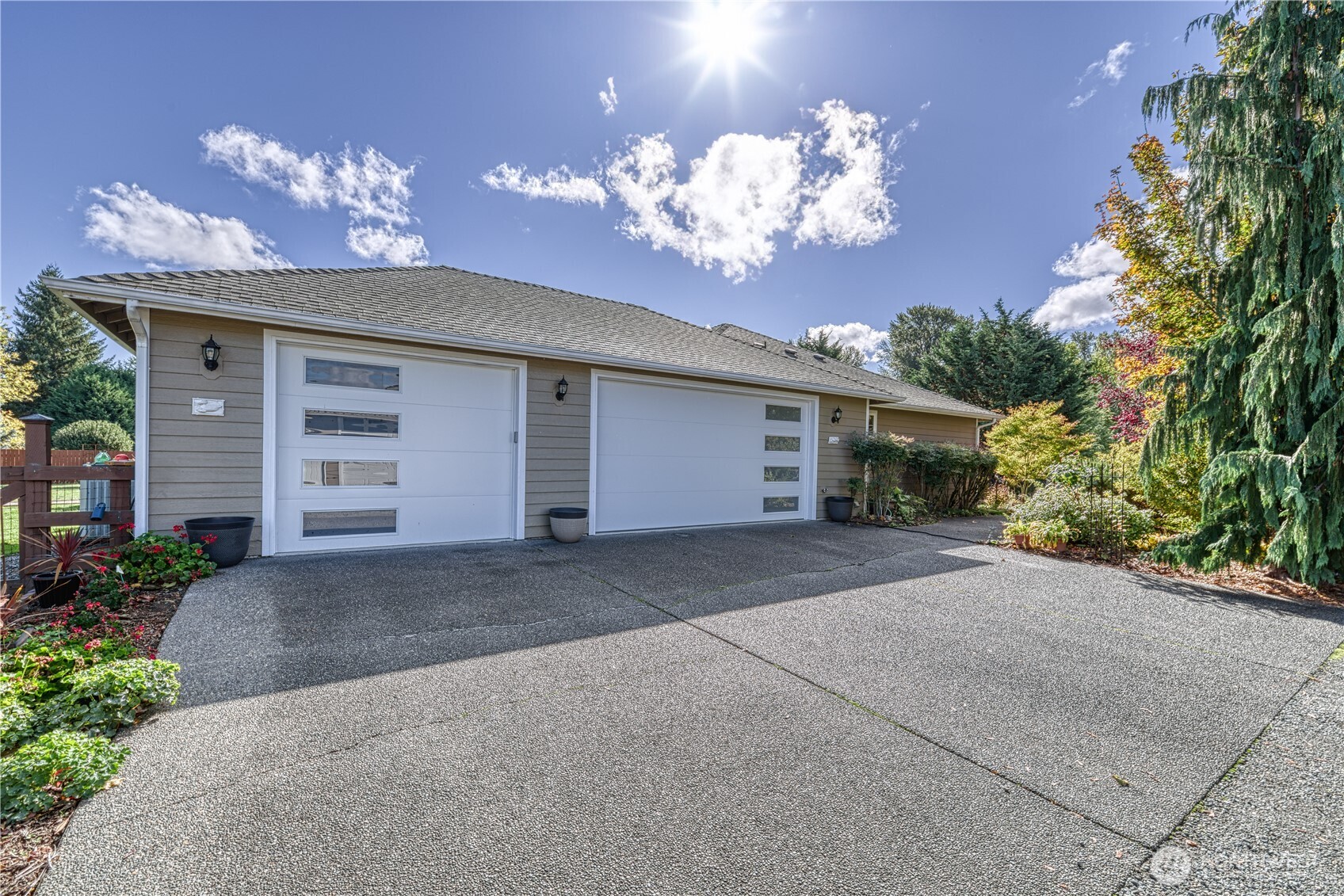 9705 346th Street South Roy, WA 98580 - Photo 28 of 34 a view of a house with a yard and potted plants