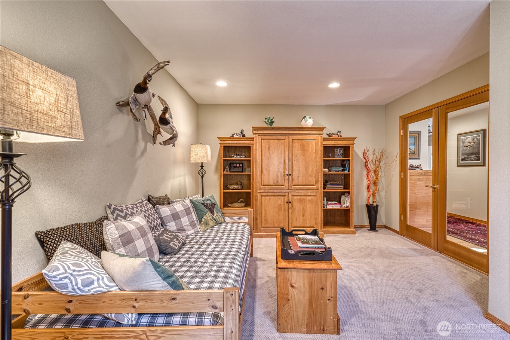 9705 346th Street South Roy, WA 98580 - Photo 6 of 34 a kitchen with stainless steel appliances kitchen island granite countertop a refrigerator and a stove