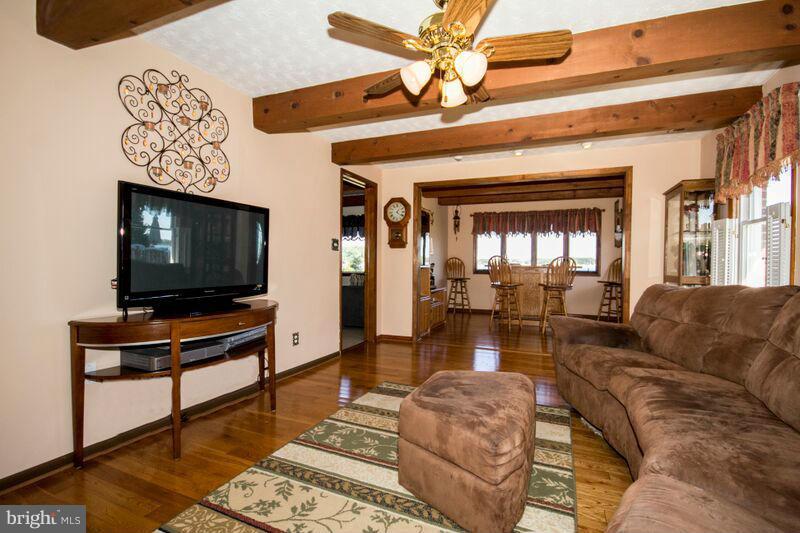 1929 Wilson Point Road Baltimore, MD 21220 - Photo 11 of 30 a living room with furniture and a flat screen tv