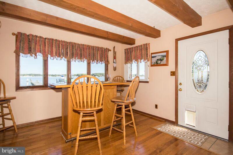 1929 Wilson Point Road Baltimore, MD 21220 - Photo 12 of 30 a view of a dining room with furniture window and wooden floor