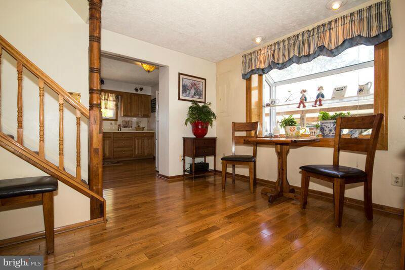 1929 Wilson Point Road Baltimore, MD 21220 - Photo 5 of 30 a dining room with furniture water view and large windows