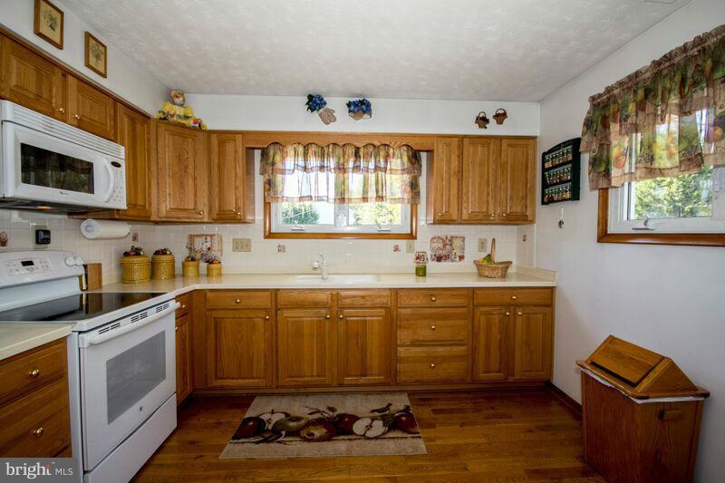 1929 Wilson Point Road Baltimore, MD 21220 - Photo 7 of 30 a kitchen with a sink cabinets and window