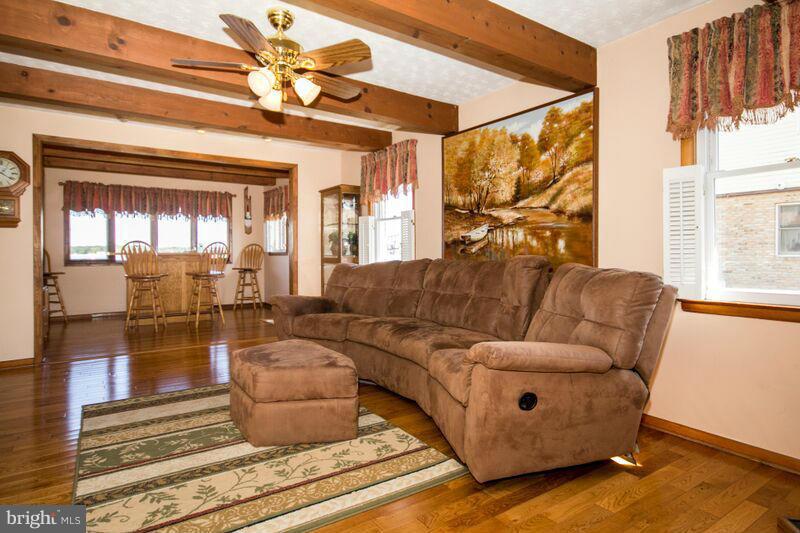 1929 Wilson Point Road Baltimore, MD 21220 - Photo 9 of 30 a living room with furniture and a large window