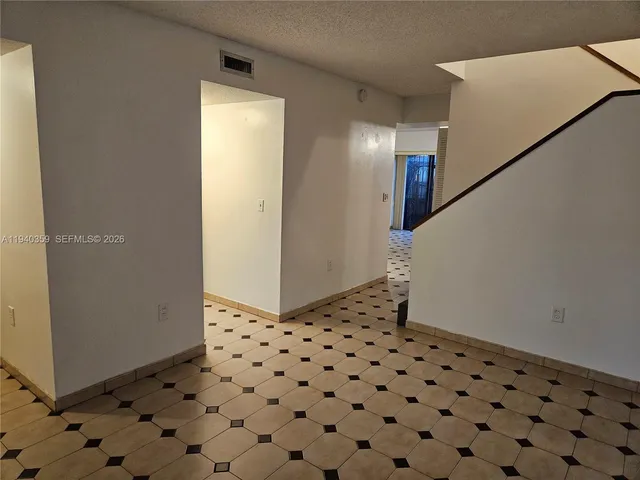 a bath tub sitting next to a white toilet and a shower