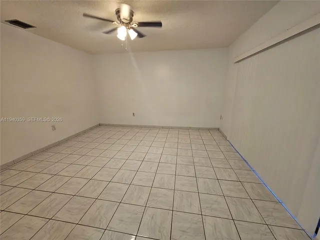 an empty room with a view of a bathroom