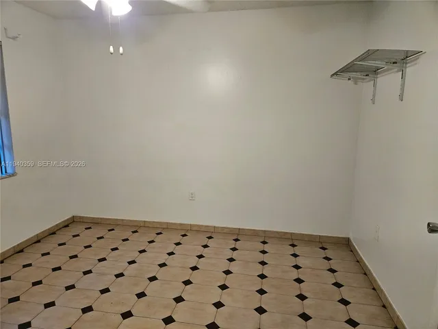 a kitchen with a sink a stove and refrigerator