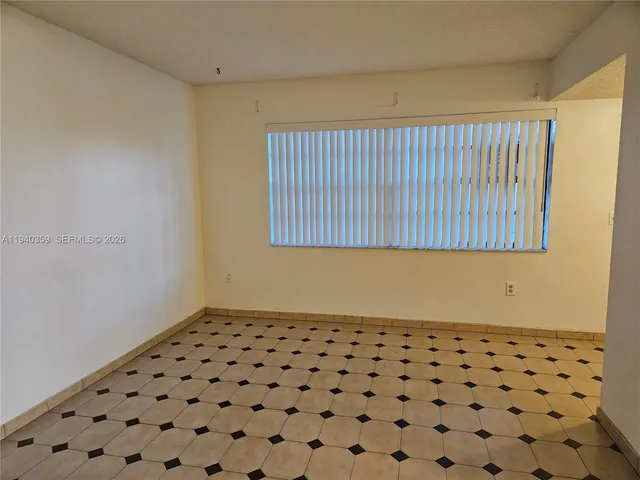 a bathroom with a black white checkered floor