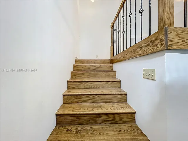 a kitchen with granite countertop stainless steel appliances and wooden cabinets