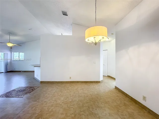 a bathroom with a granite countertop sink a toilet and bathtub