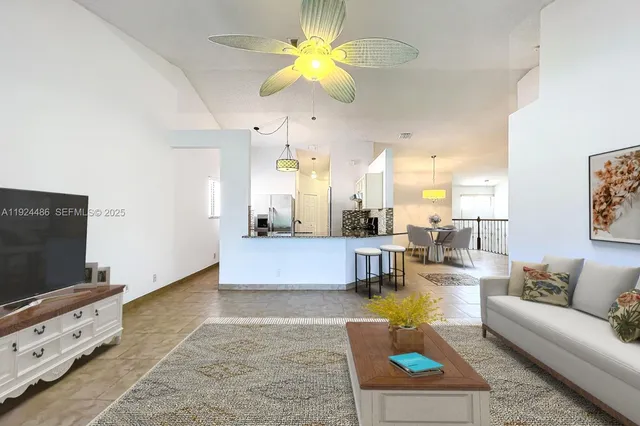 a front view of a house with a garden and plants