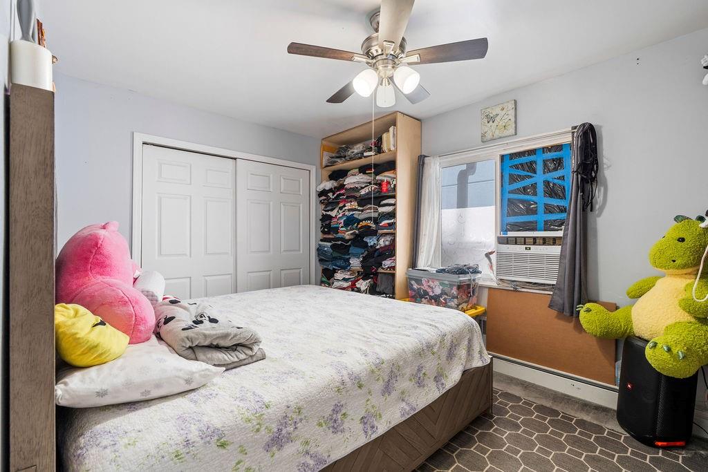 32 Brighton 2nd Place Brooklyn, NY 11235 - Photo 11 of 23 a bedroom with a bed and a window