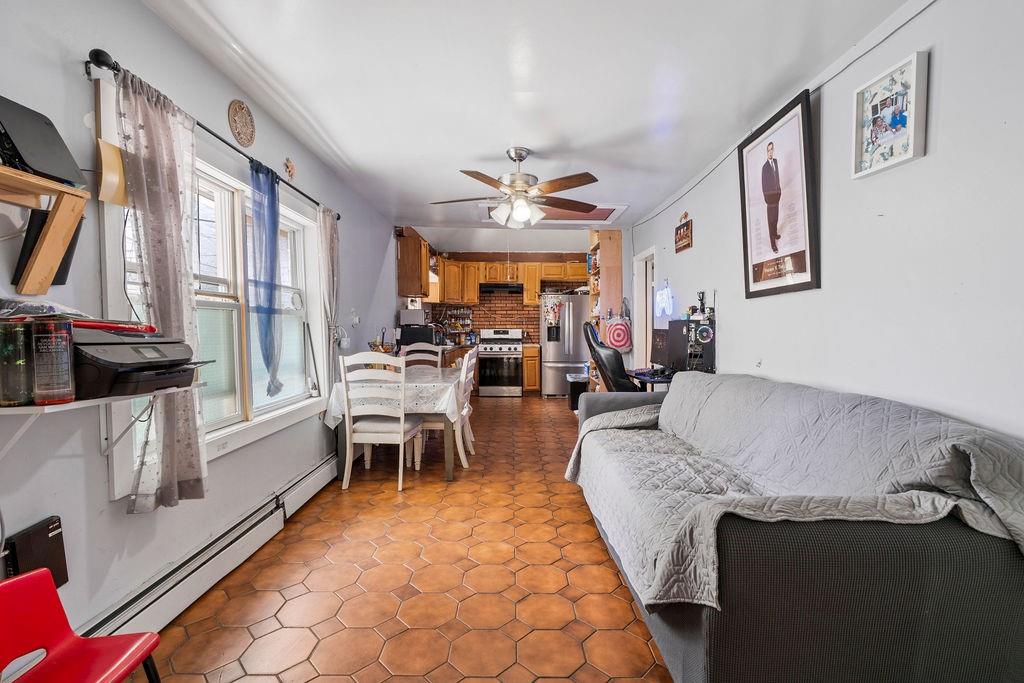 32 Brighton 2nd Place Brooklyn, NY 11235 - Photo 12 of 23 a living room with furniture and a large window