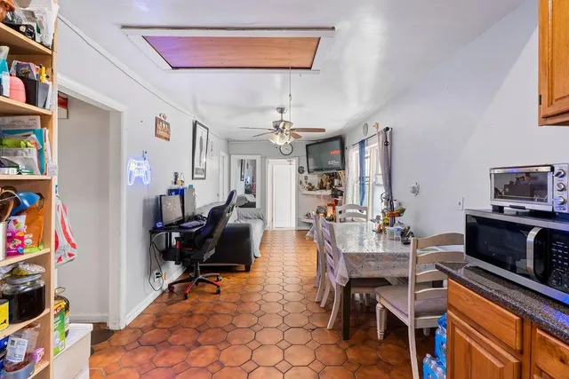 a bathroom with a sink a toilet and shower curtain