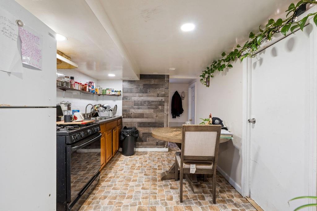 32 Brighton 2nd Place Brooklyn, NY 11235 - Photo 19 of 23 a kitchen with a sink and cabinets