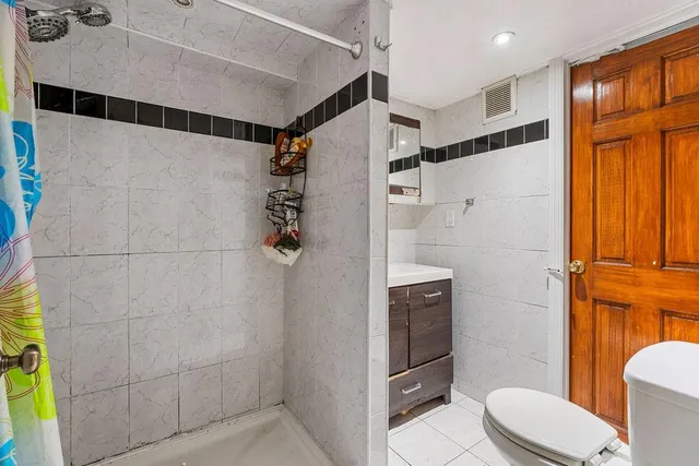 a bedroom with a bed and a closet