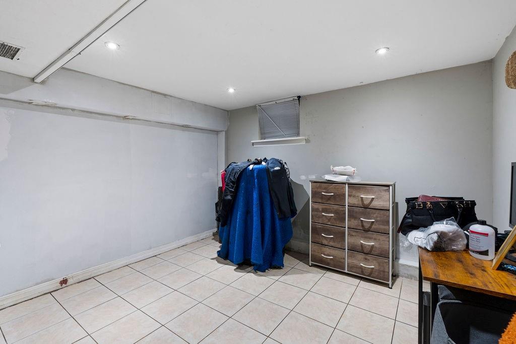 32 Brighton 2nd Place Brooklyn, NY 11235 - Photo 22 of 23 a view of walk in closet with clothes and shoes