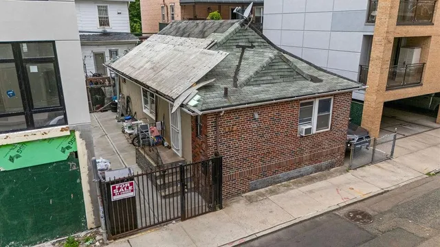 a aerial view of a house with patio outdoor seating area