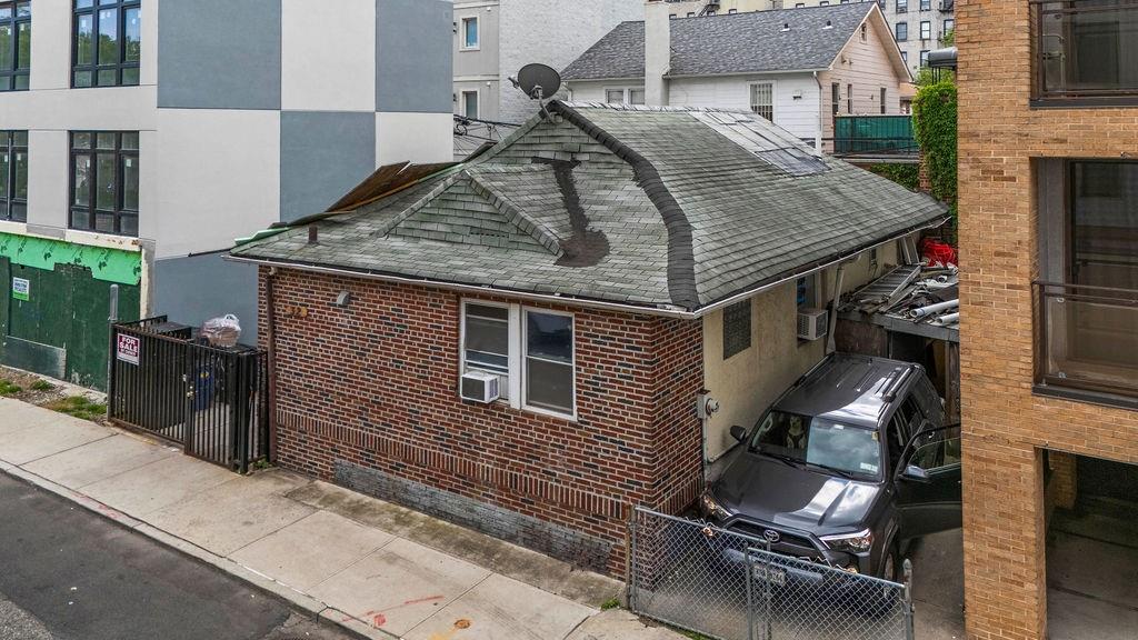 32 Brighton 2nd Place Brooklyn, NY 11235 - Photo 4 of 23 a aerial view of a house with patio outdoor seating area