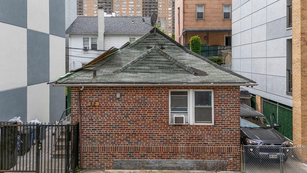 32 Brighton 2nd Place Brooklyn, NY 11235 - Photo 5 of 23 a view of a brick house with many windows