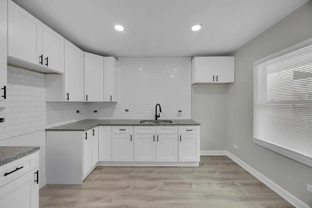 a view of cabinets a sink and dishwasher in a kitchen