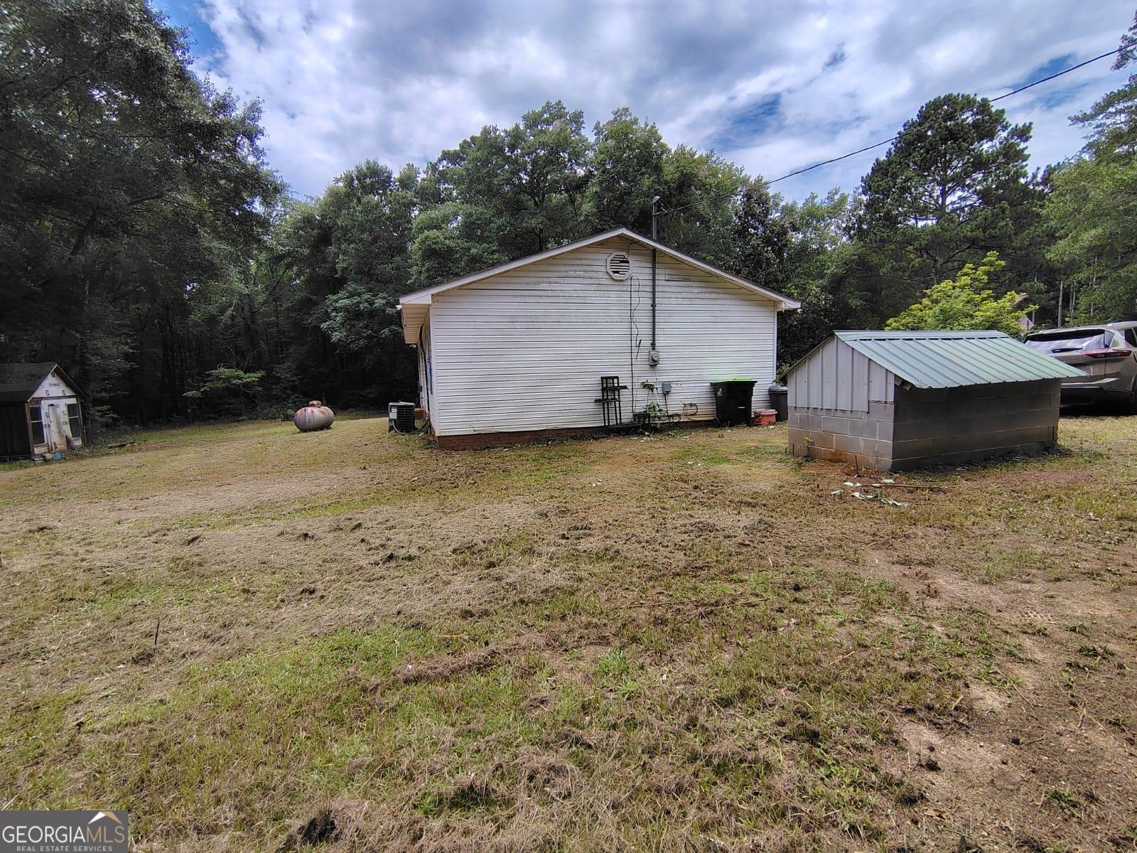 5576 Po Biddy Road Talbotton, GA 31827 - Photo 18 of 28 a view of a house with a yard