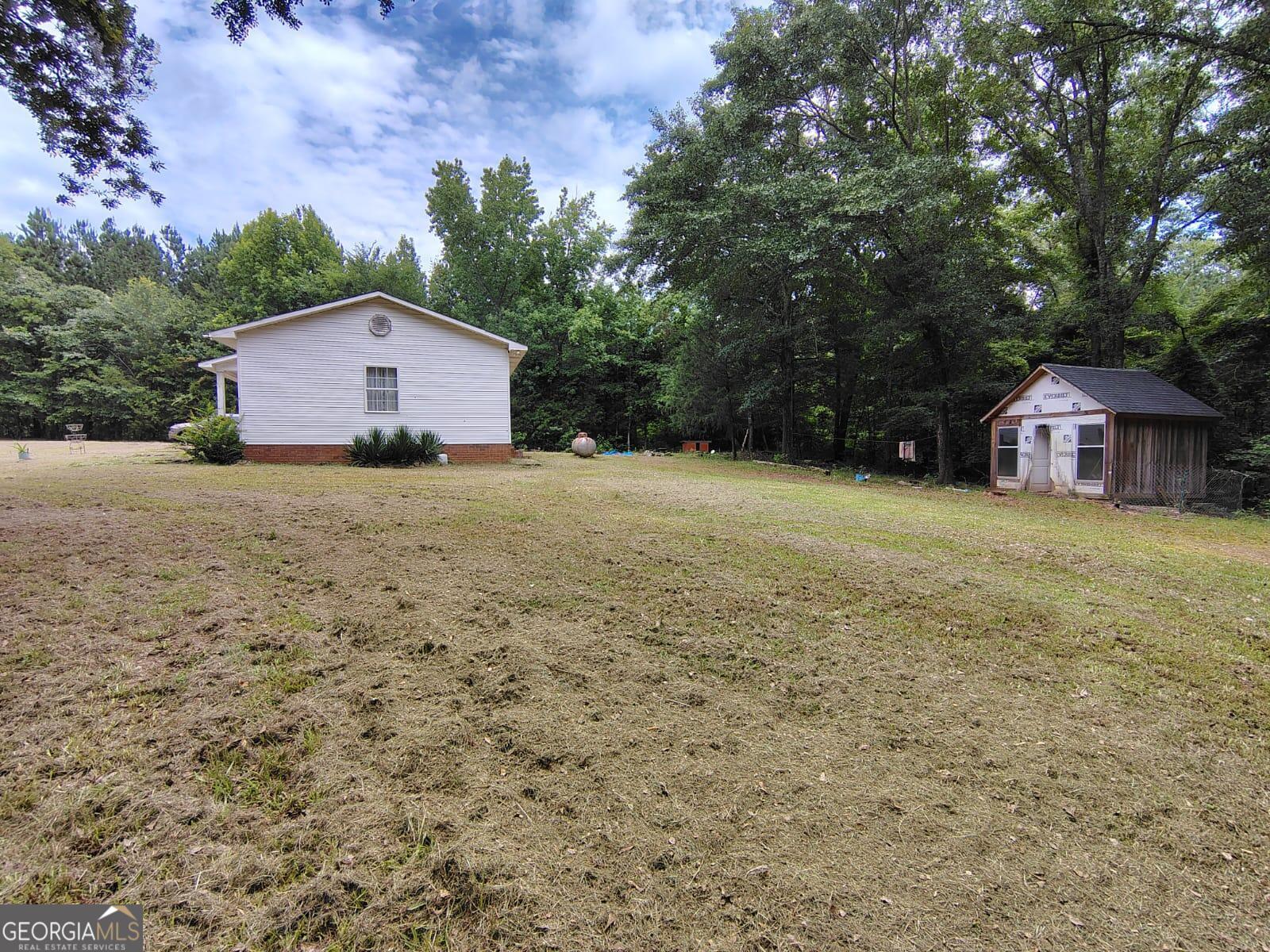 5576 Po Biddy Road Talbotton, GA 31827 - Photo 20 of 28 a view of a house with a yard