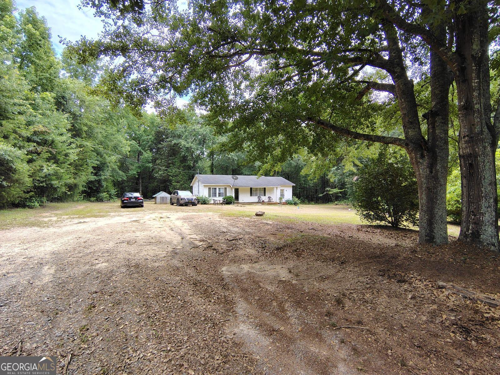 5576 Po Biddy Road Talbotton, GA 31827 - Photo 28 of 28 a view of house with trees in the background