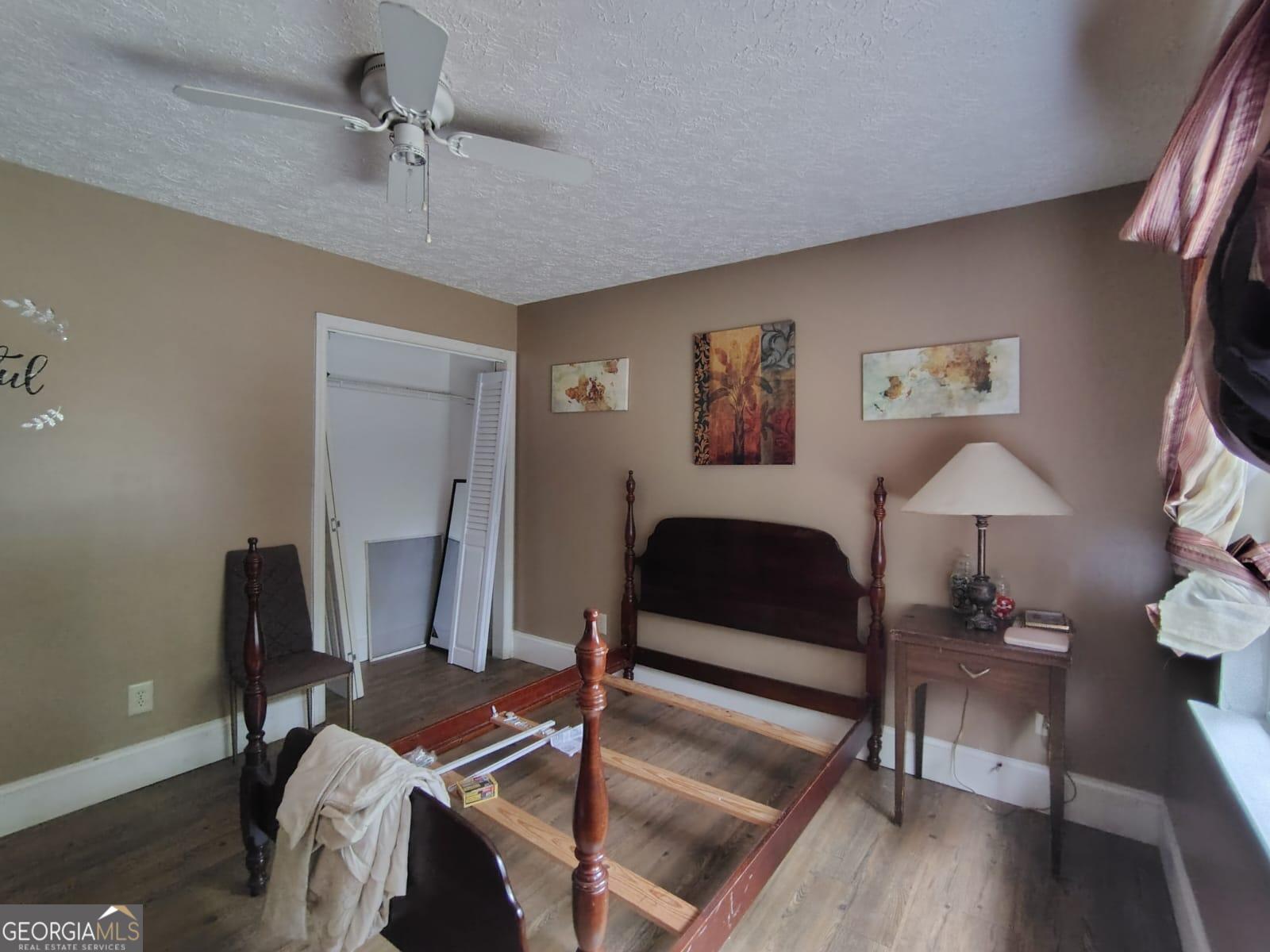 5576 Po Biddy Road Talbotton, GA 31827 - Photo 7 of 28 a bedroom with furniture and a window