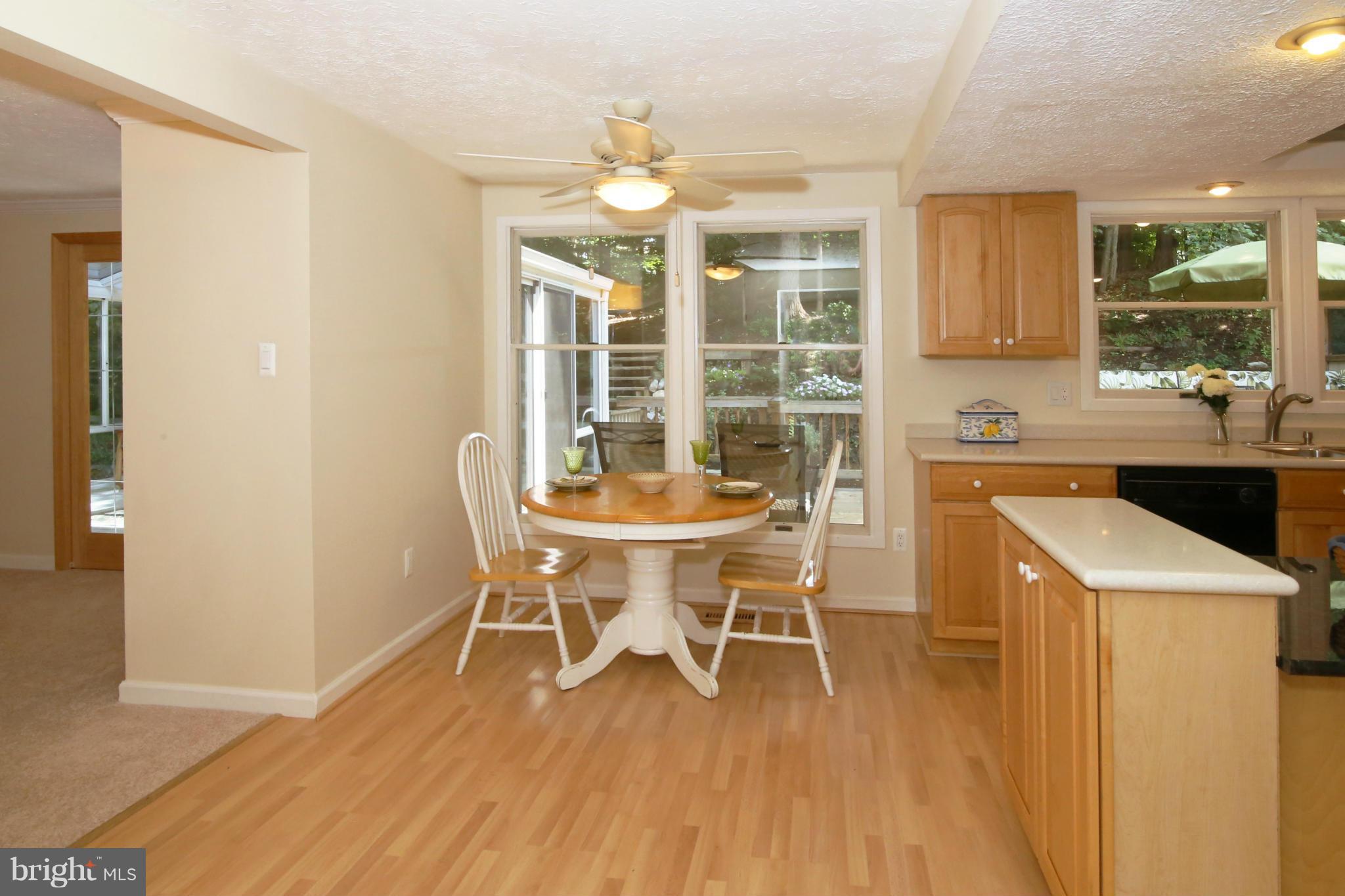 7575 Vogels Way Springfield, VA 22153 - Photo 14 of 30 a dining room with furniture and wooden floor