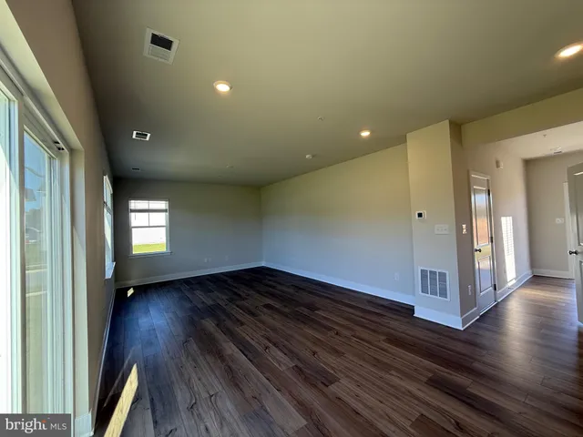 a bathroom with a double vanity sink toilet and shower