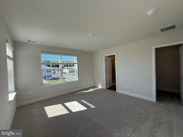 a bathroom with a shower a sink and a toilet